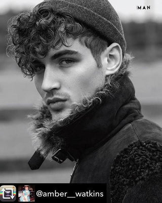 Man in wool beanie and shearling jacket outdoors, stylish fall winter menswear look