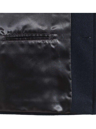 Close-up of black wool coat interior with satin lining and welt pocket