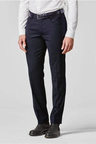 Man wearing navy dress pants with black belt, white shirt, and black formal shoes