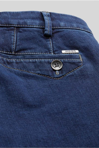 Close-up of Meyer men's blue denim jeans back pocket with button and logo detail