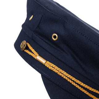 navy blue captain’s hat with gold braided rope and anchor button detail