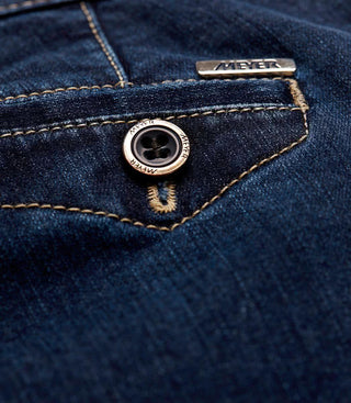 Close-up of Meyer jeans pocket with visible stitching and branded metal button