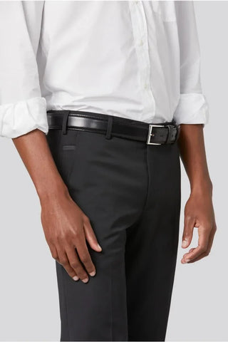 Man wearing black wool dress pants with black leather belt and white dress shirt