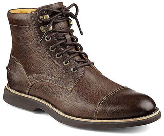 Men's brown leather cap toe boot with laces and rugged sole on white background